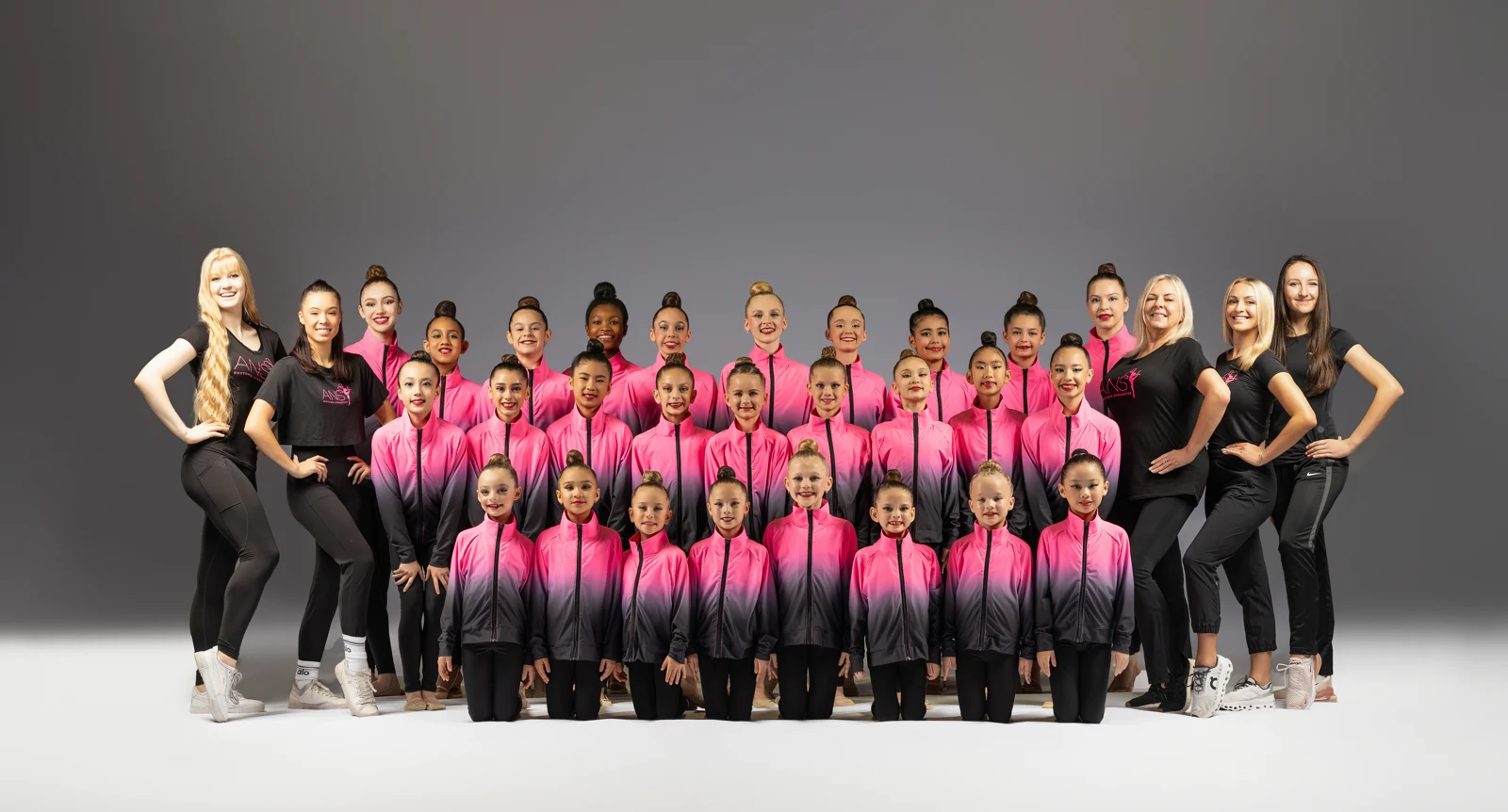ANS Rhythmics athletes and coaches together in the studio